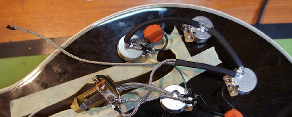 Braided shielded wiring harness with common ground